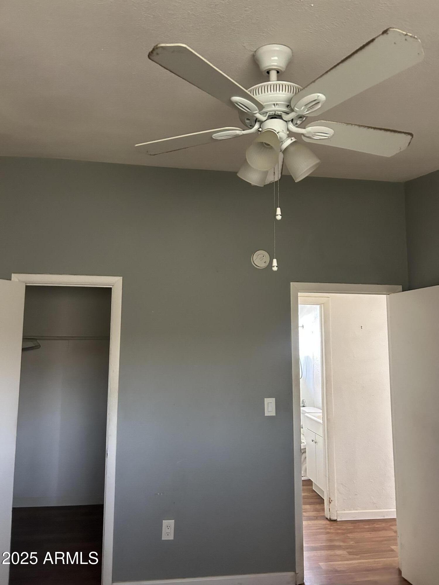 1801 West Carol Avenue, Unit 3 Phoenix, AZ 85021 - Photo 8 of 10 a view of a chandelier fan in a room