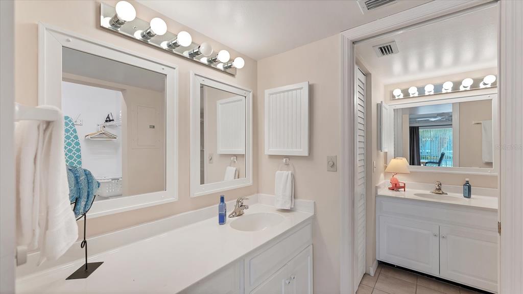 450 Cerromar Road, Unit 282 Venice, FL 34293 - Photo 17 of 44 a en suite bathroom with a sink double vanity and mirror