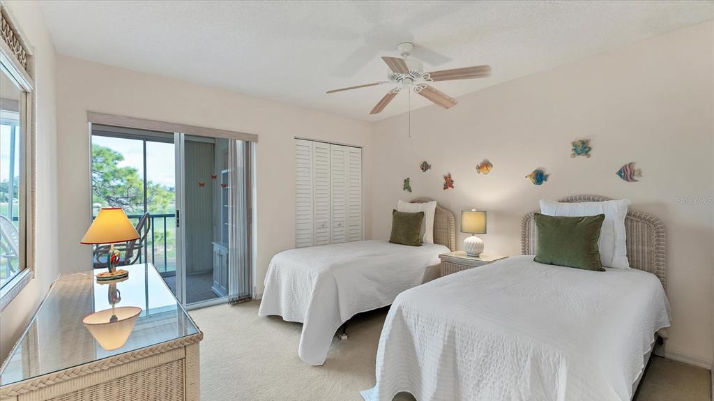 450 Cerromar Road, Unit 282 Venice, FL 34293 - Photo 19 of 44 a bedroom with two beds and painted walls