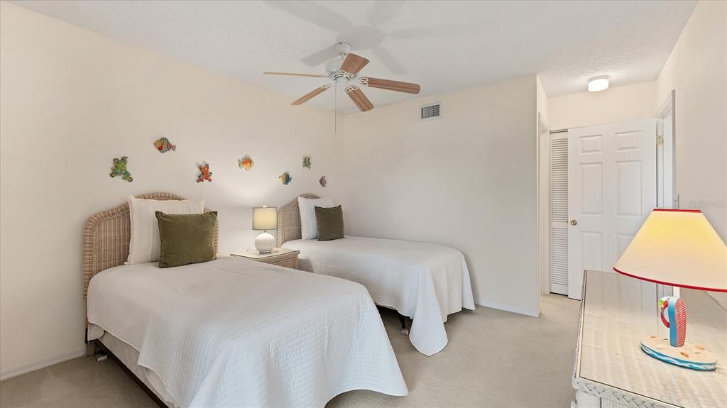 450 Cerromar Road, Unit 282 Venice, FL 34293 - Photo 20 of 44 a bedroom with a bed and a table