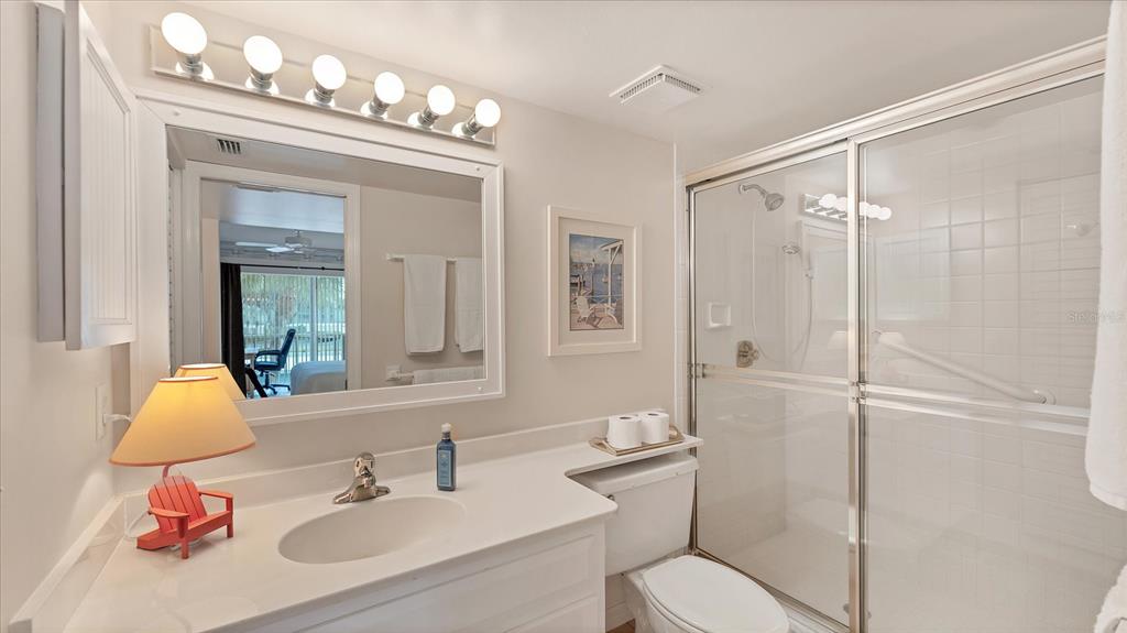 450 Cerromar Road, Unit 282 Venice, FL 34293 - Photo 22 of 44 a bathroom with a sink vanity mirror and toilet