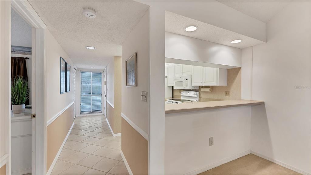 450 Cerromar Road, Unit 282 Venice, FL 34293 - Photo 3 of 44 a bathroom with a sink a mirror and a toilet