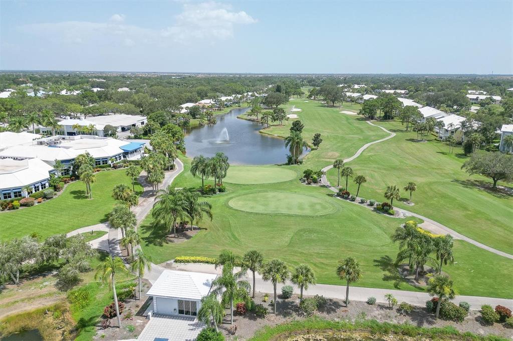 450 Cerromar Road, Unit 282 Venice, FL 34293 - Photo 38 of 44 an aerial view of residential houses with outdoor space and trees