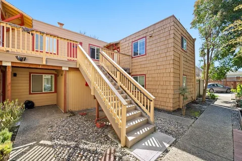 a view of a house with wooden stairs