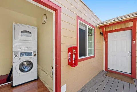 a view of balcony with wooden floor and fence