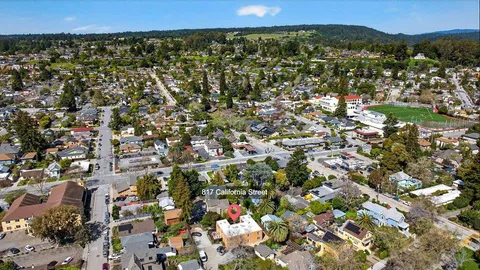 an aerial view of multiple houses with outdoor space
