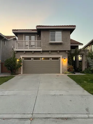 a front view of a house with yard