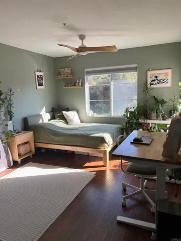 a living room with furniture pool table and a window