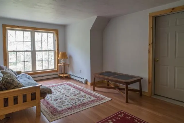a living room with a couch and a window
