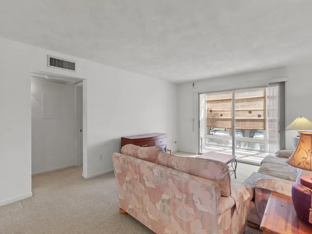 a bed room with a bed and a window