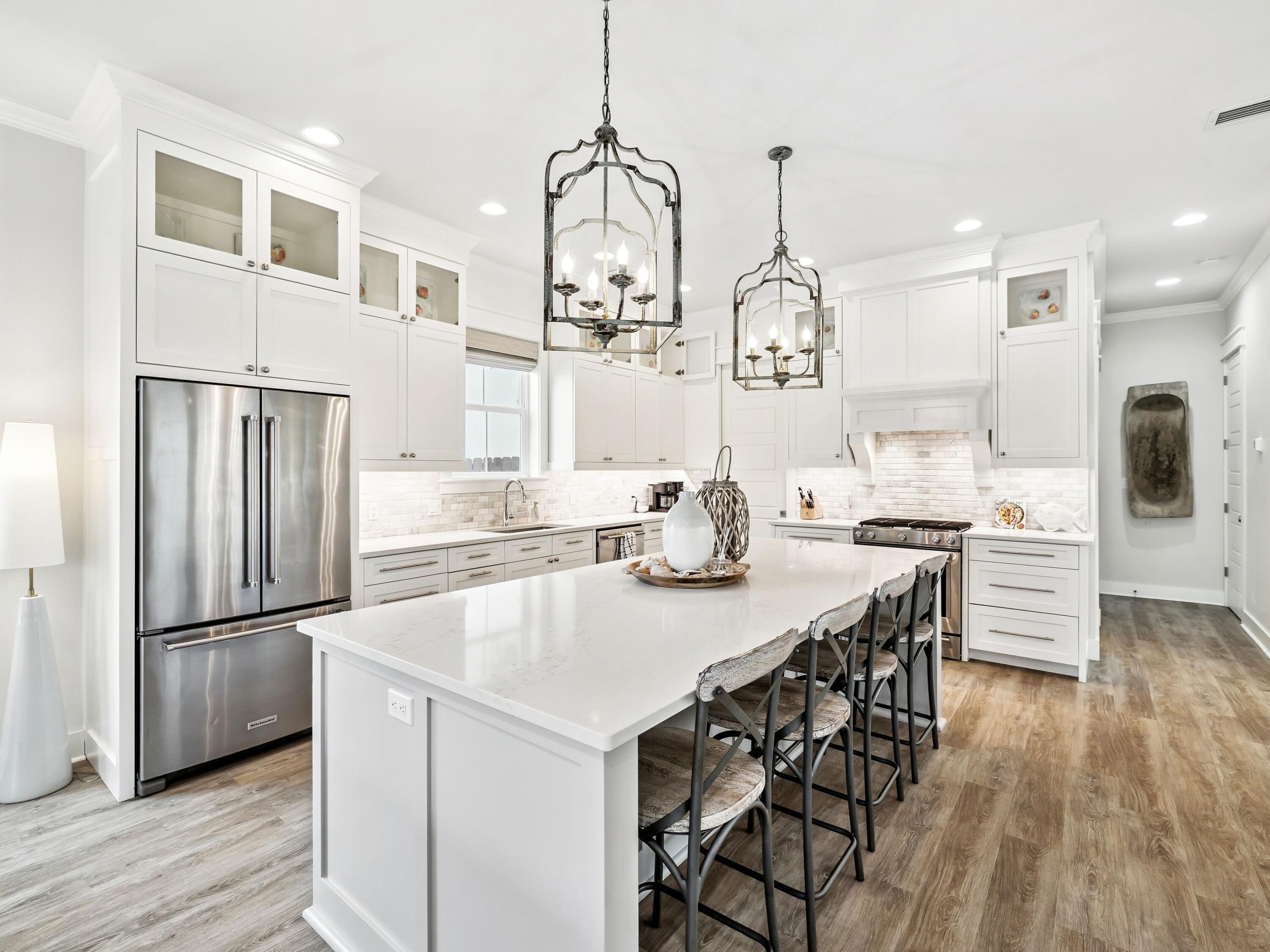 29 Tidewater Ct Inlet Beach Inlet Beach, FL 32461 - Photo 7 of 25 a kitchen with stainless steel appliances granite countertop a sink a stove and refrigerator