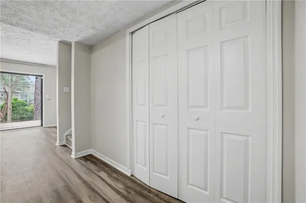 a view of a livingroom with wooden floor