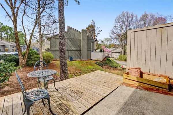 a view of a backyard with sitting area