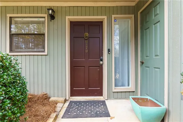 a view of a door and a window