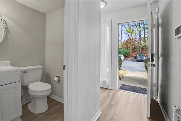 a bathroom with a toilet and a shower