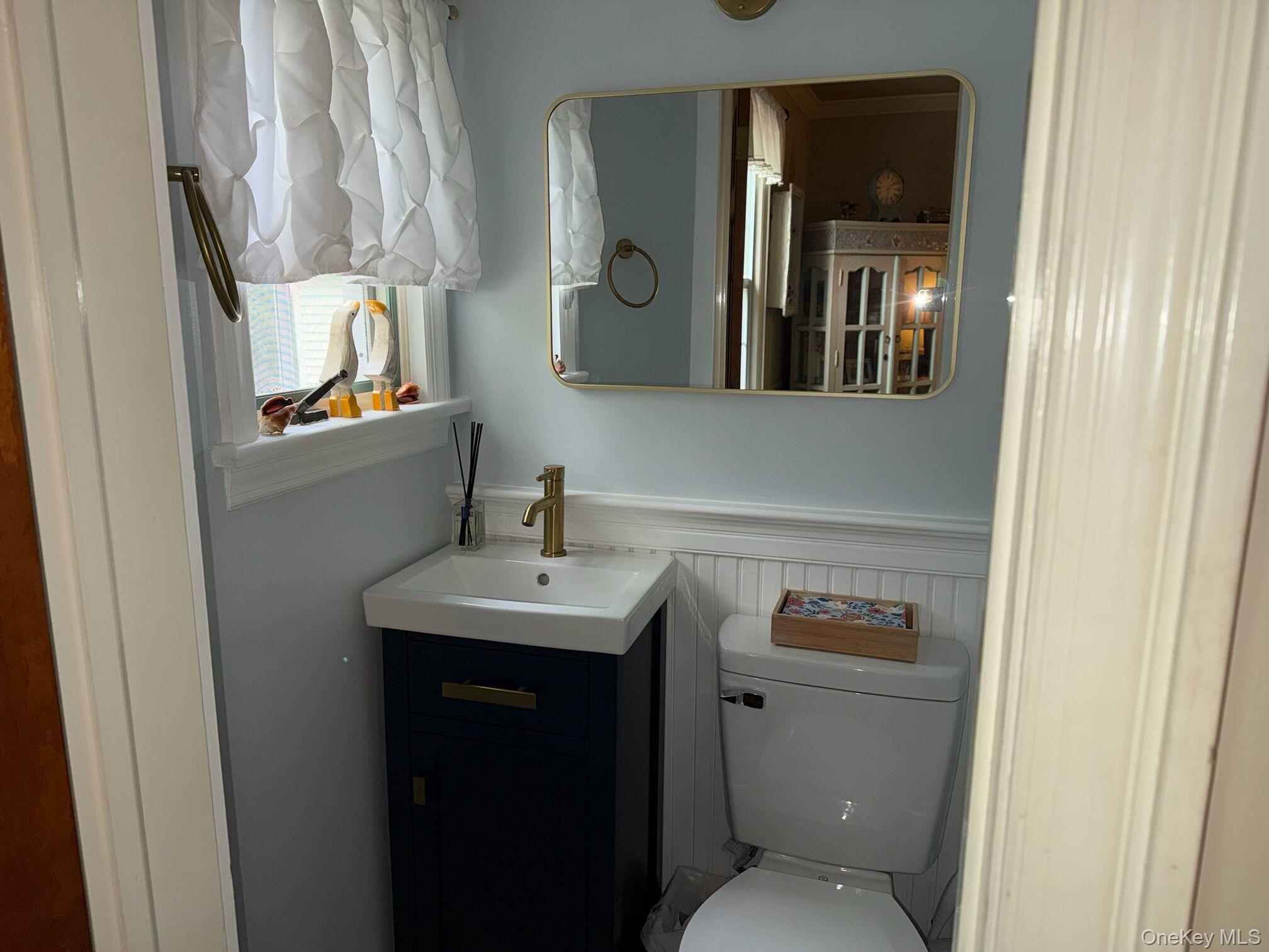 37 Eimer Street Tappan, NY 10983 - Photo 12 of 16 a bathroom with a toilet a sink and mirror