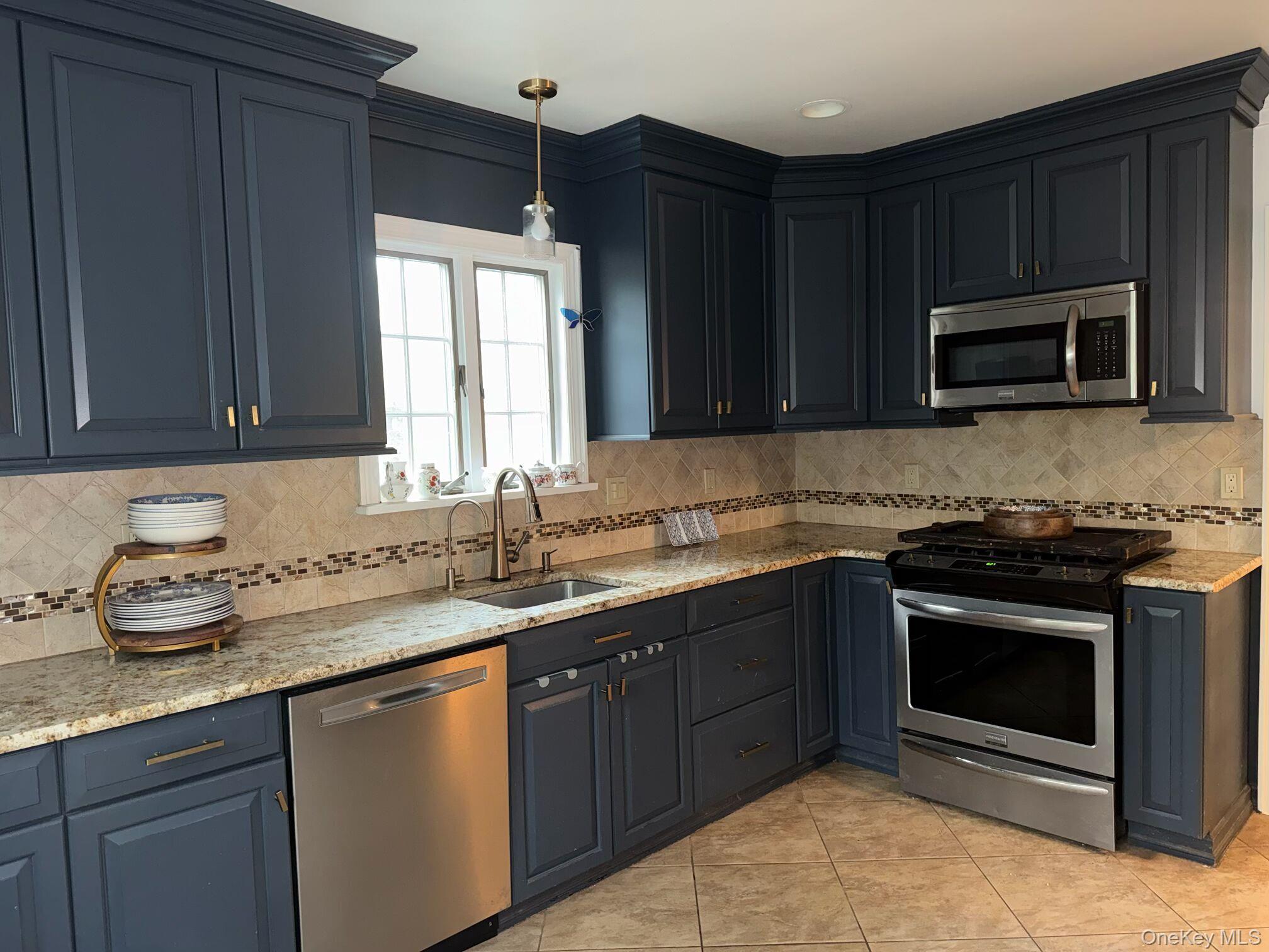 37 Eimer Street Tappan, NY 10983 - Photo 3 of 16 a kitchen with sink cabinets and microwave