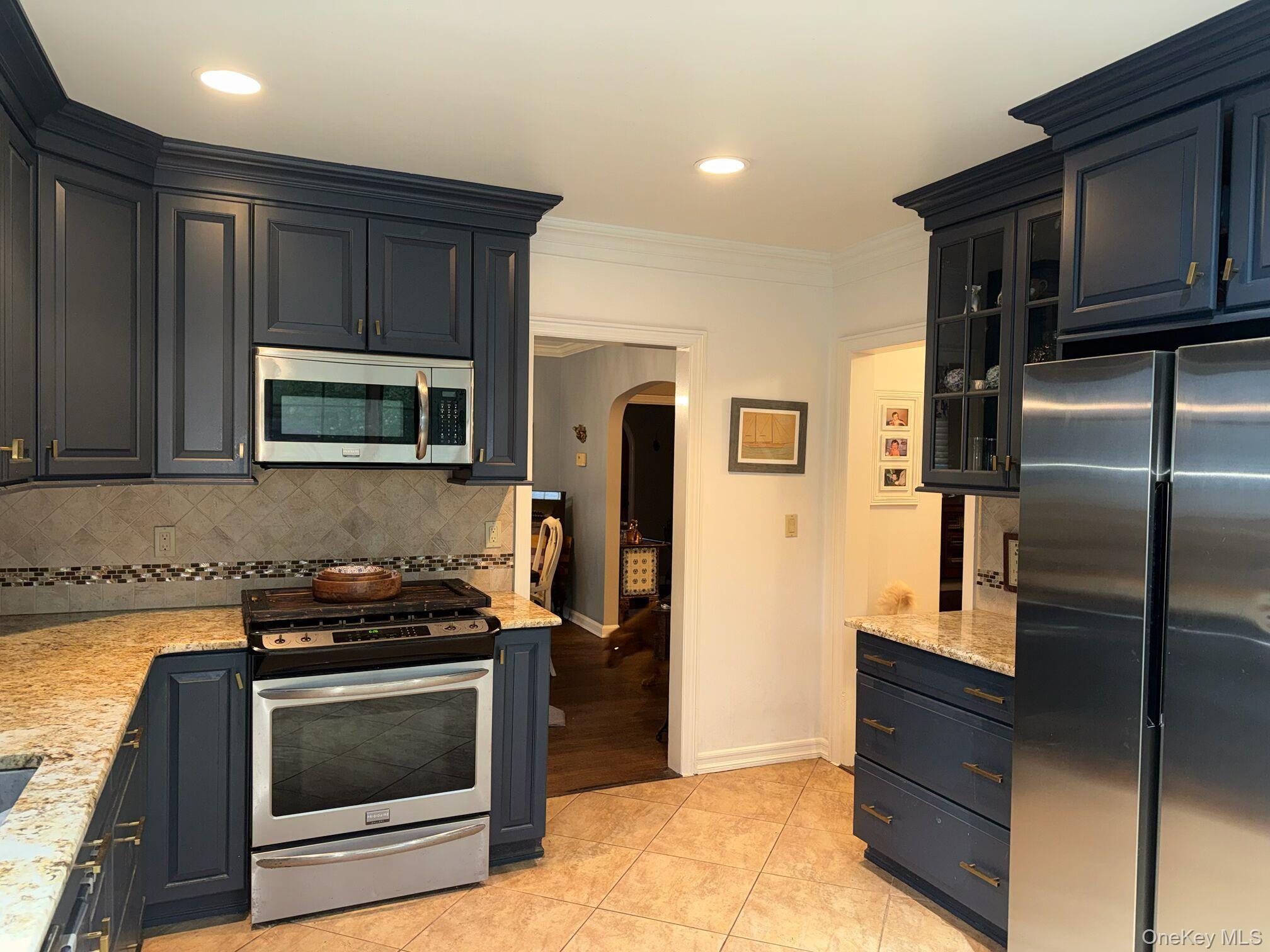 37 Eimer Street Tappan, NY 10983 - Photo 4 of 16 a kitchen with stainless steel appliances granite countertop a stove microwave and refrigerator