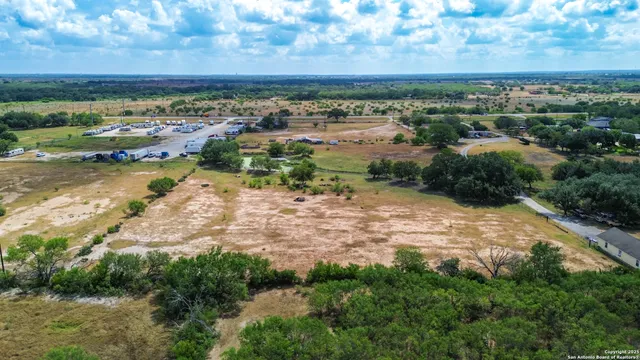 a view of a lake with houses in the back