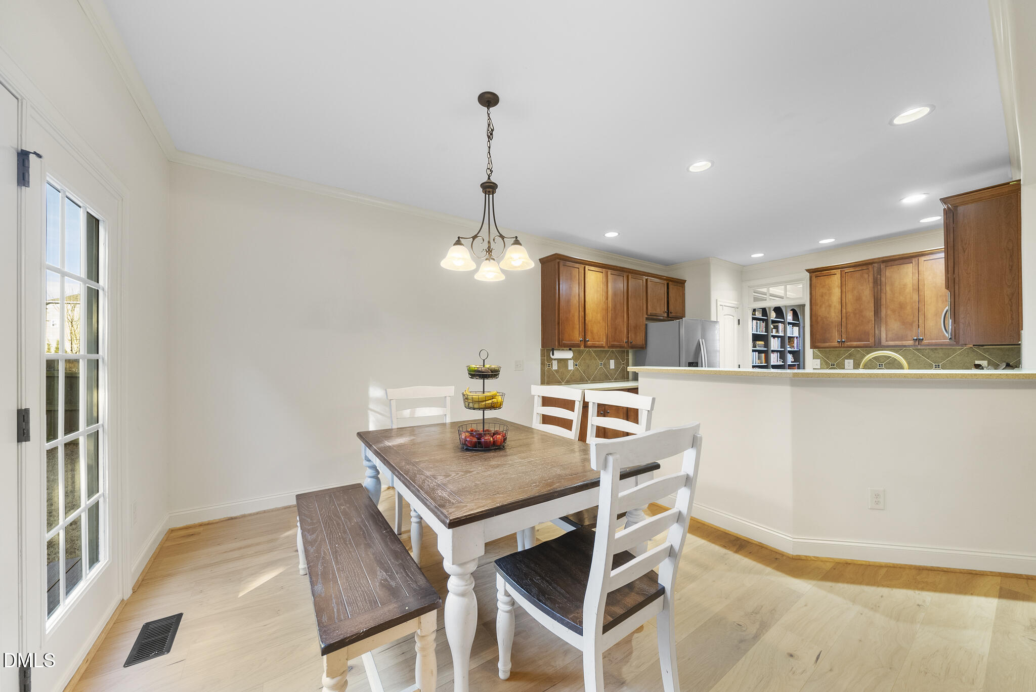 437 Big Willow Way Rolesville, NC 27571 - Photo 15 of 43 a kitchen with a table and chairs in it