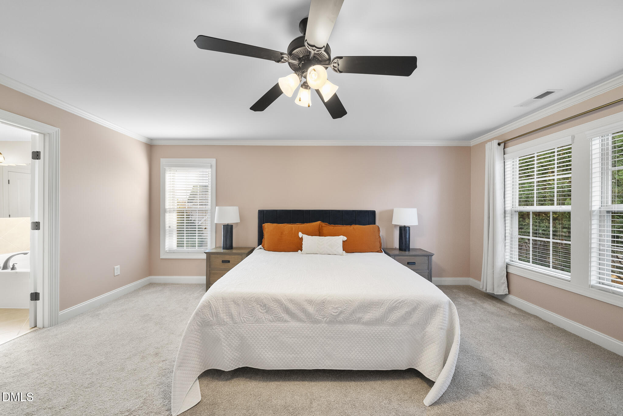 437 Big Willow Way Rolesville, NC 27571 - Photo 21 of 43 a bedroom with a large bed and a large window