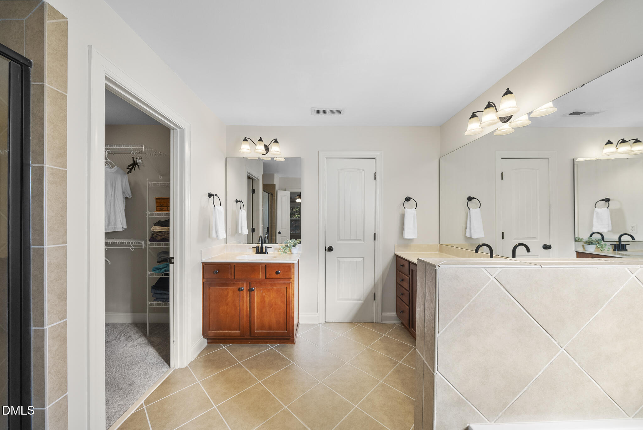437 Big Willow Way Rolesville, NC 27571 - Photo 23 of 43 a large white kitchen with cabinets and stainless steel appliances