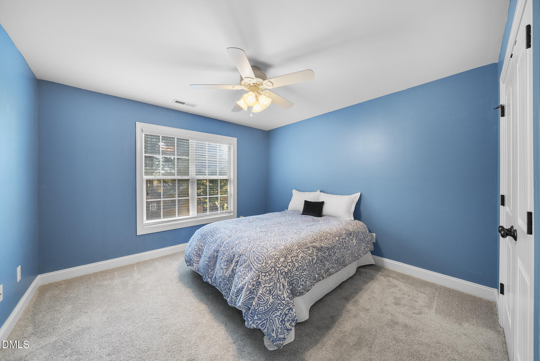 437 Big Willow Way Rolesville, NC 27571 - Photo 27 of 43 a bedroom with a bed and a window
