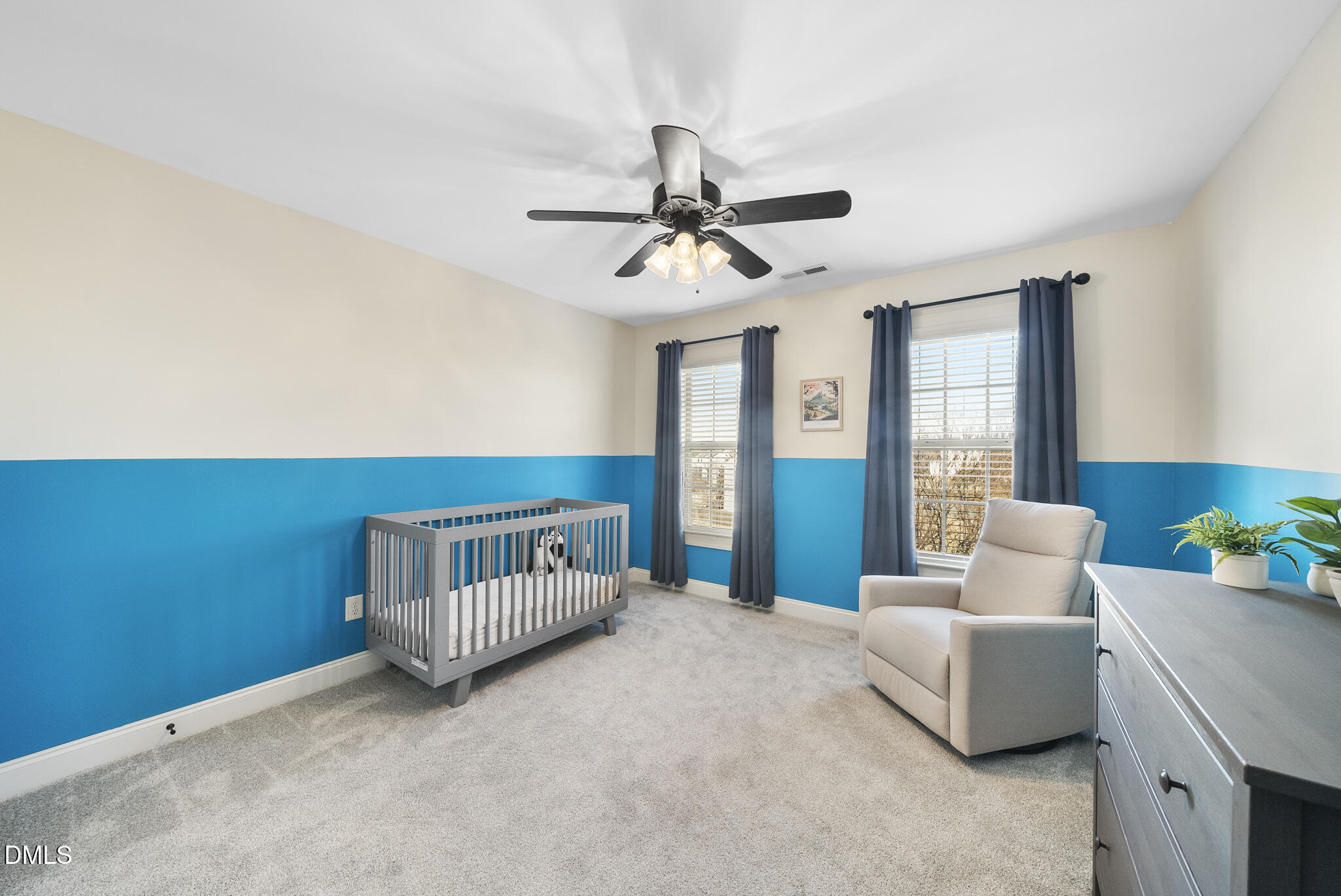 437 Big Willow Way Rolesville, NC 27571 - Photo 29 of 43 a living room with furniture and a chandelier