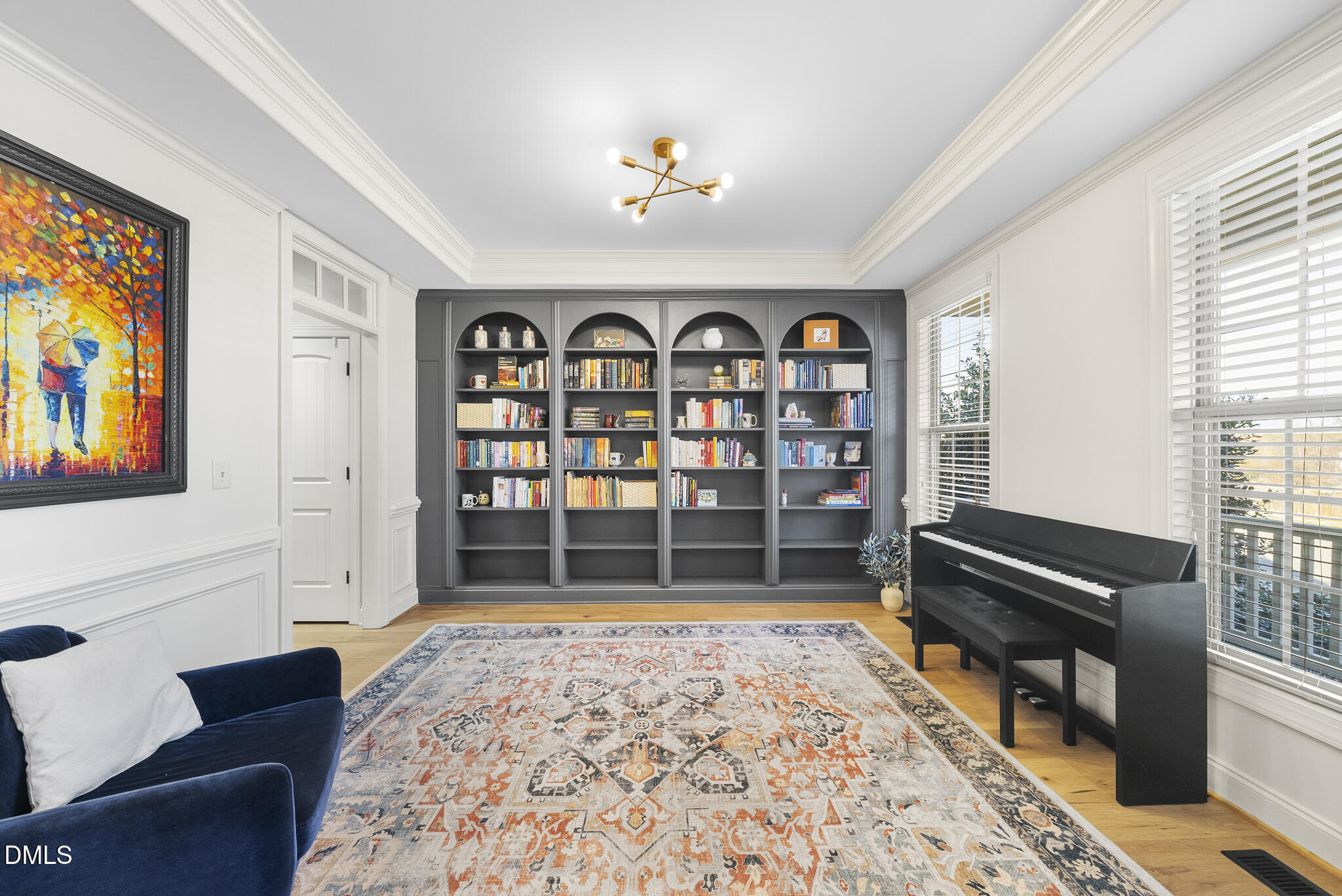 437 Big Willow Way Rolesville, NC 27571 - Photo 3 of 43 a living room with fish tank and a bookshelf