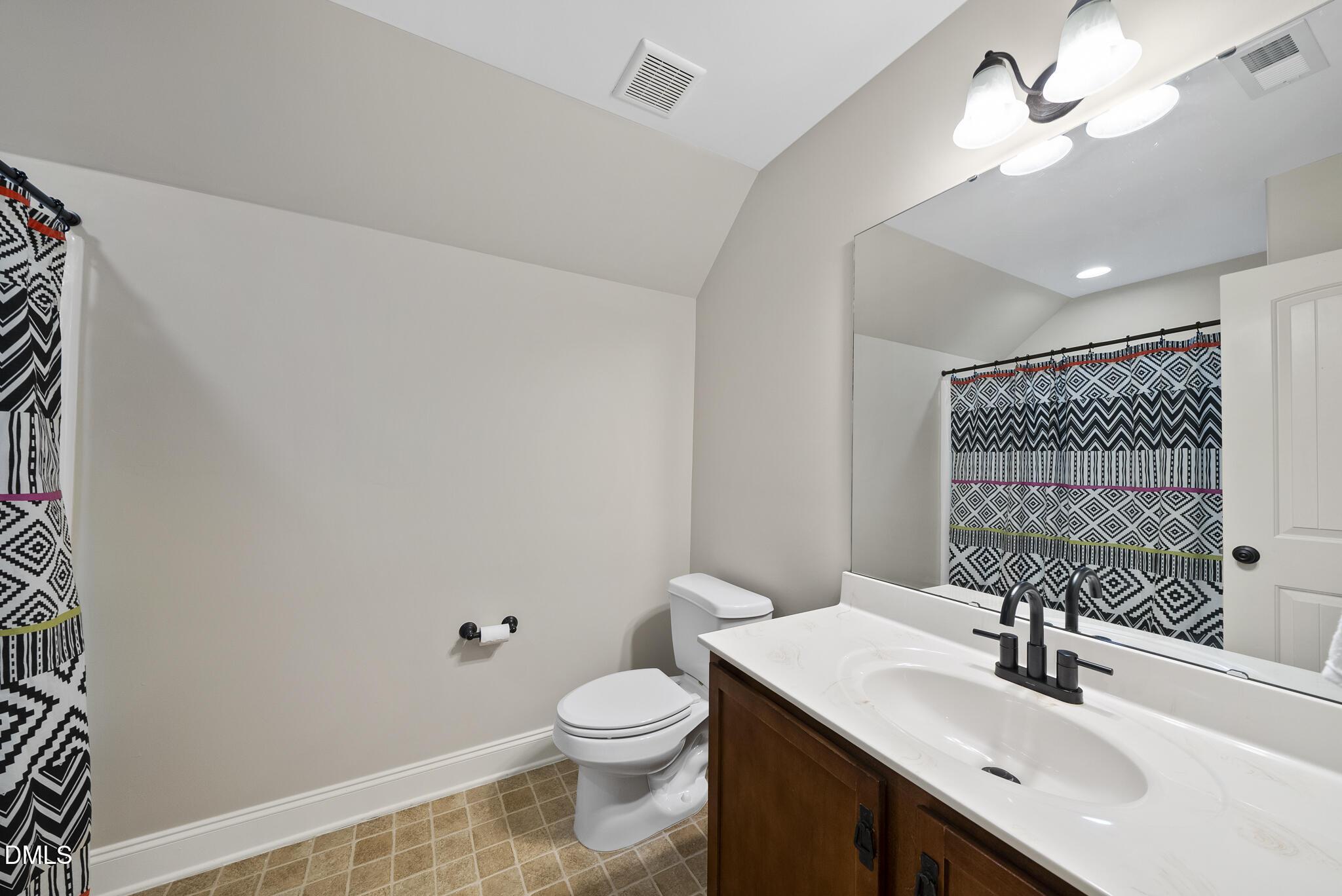 437 Big Willow Way Rolesville, NC 27571 - Photo 36 of 43 a bathroom with a sink a toilet and mirror