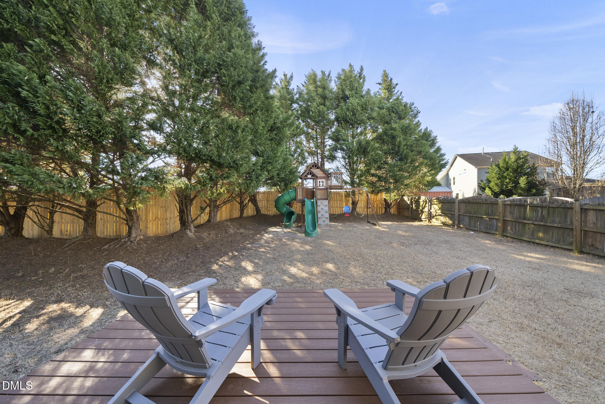 437 Big Willow Way Rolesville, NC 27571 - Photo 37 of 43 a backyard of a house with table and chairs