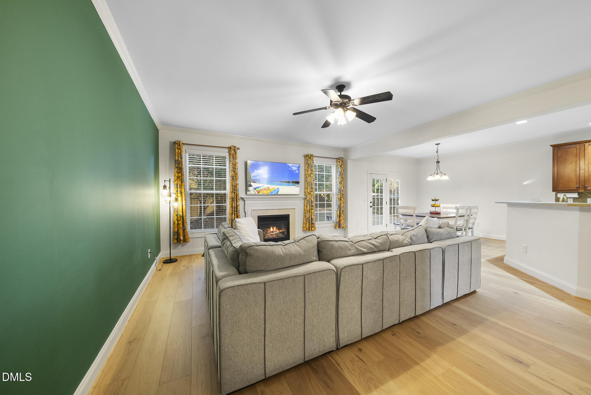 437 Big Willow Way Rolesville, NC 27571 - Photo 4 of 43 a living room with stainless steel appliances kitchen island furniture and a chandelier