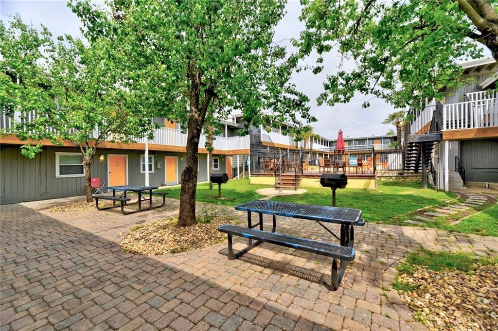 2401 Manor Road, Unit 102 Austin, TX 78722 - Photo 7 of 22 View of community featuring a patio and a wooden deck