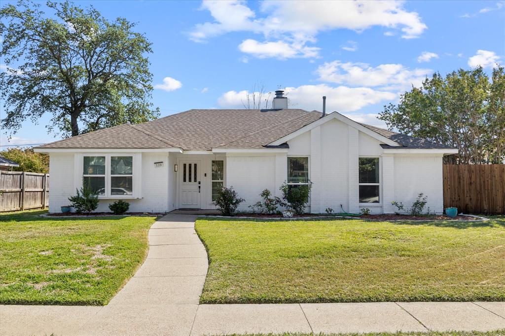 126 Ridgegate Drive Garland, TX 75040 - Photo 1 of 1 a front view of a house with a yard and garage