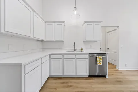 a kitchen with stainless steel appliances granite countertop a sink and a granite counter tops