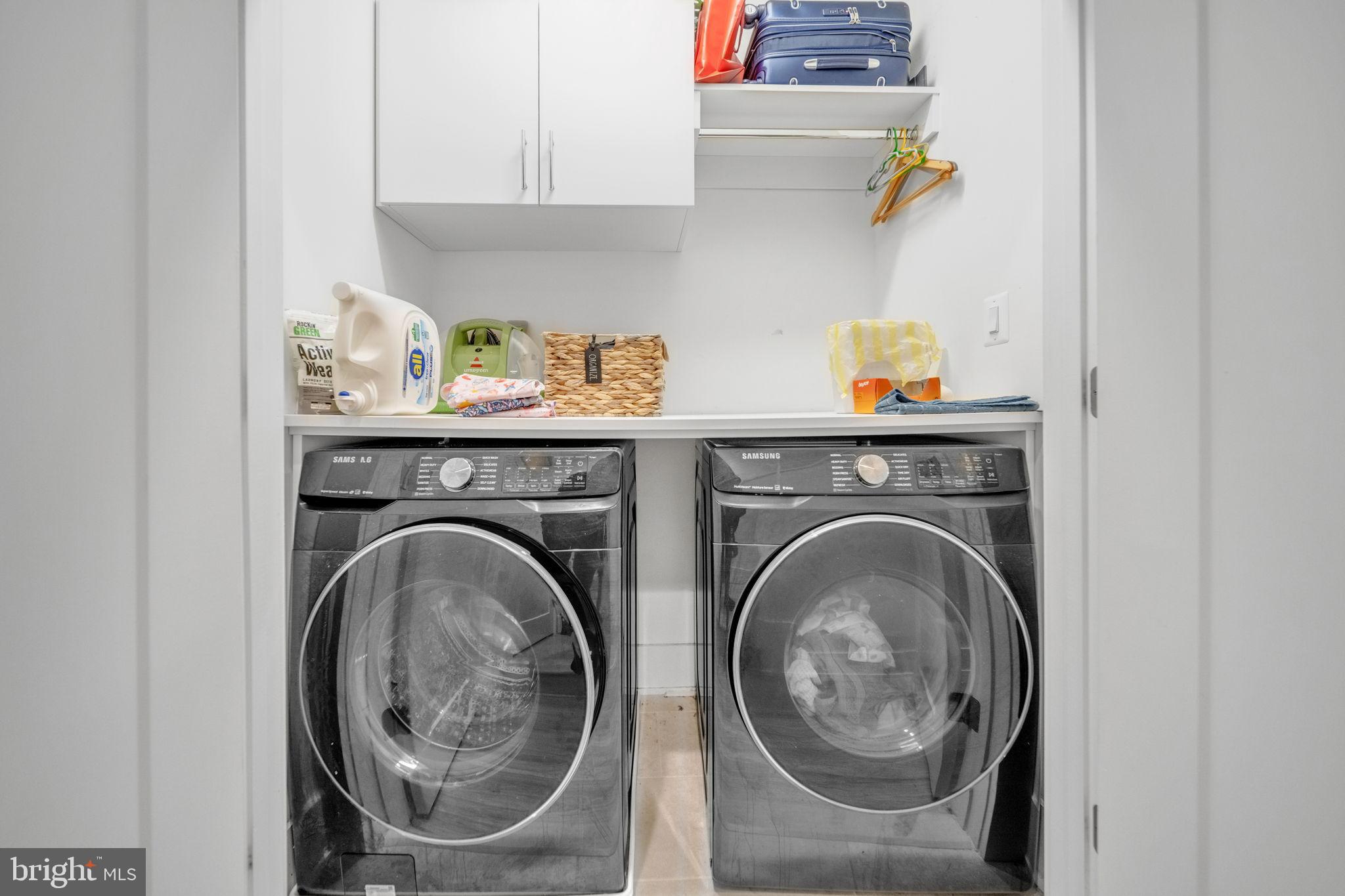 11326 Emerald Park Road Potomac, MD 20854 - Photo 18 of 40 Modern laundry space with sleek appliances.