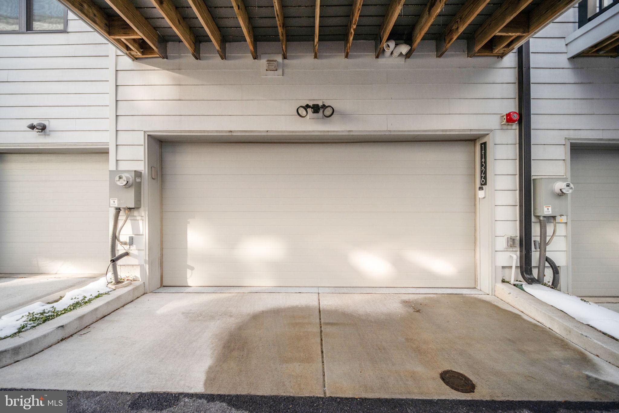 11326 Emerald Park Road Potomac, MD 20854 - Photo 32 of 40 Modern garage entrance with clean lines.