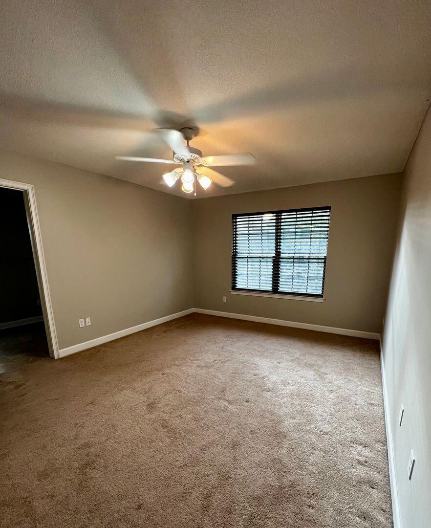 23 3rd Street Shalimar, FL 32579 - Photo 12 of 15 an empty room with windows