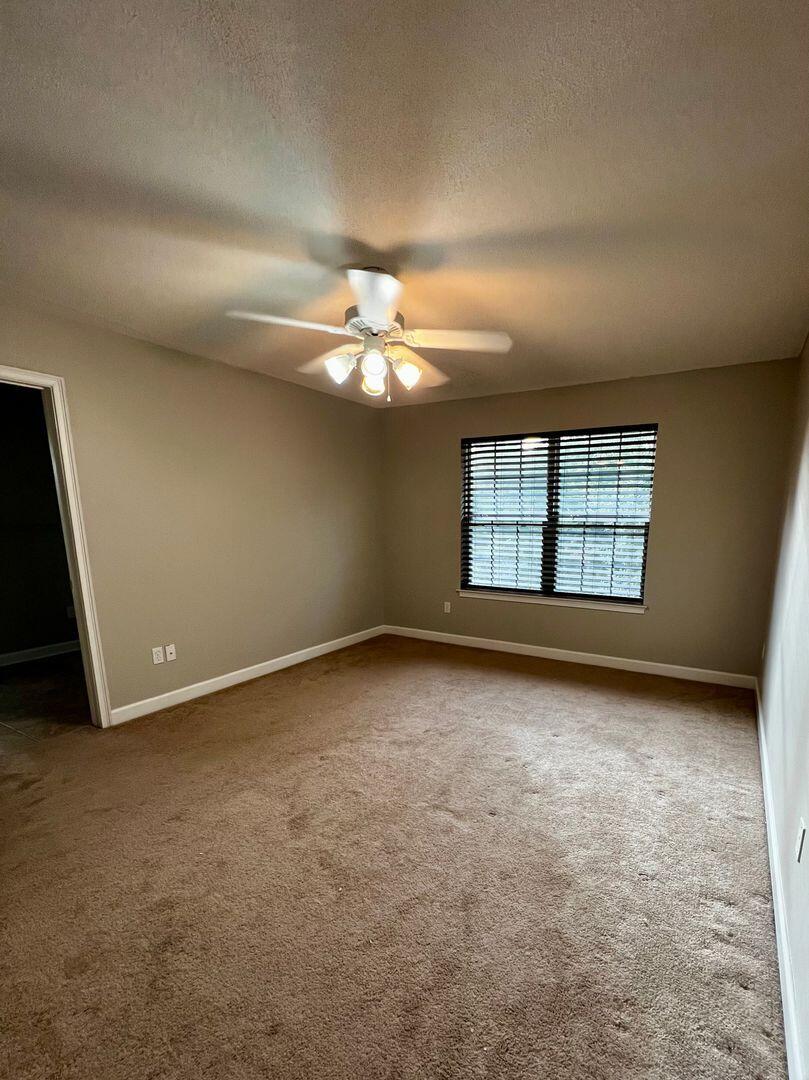 23 3rd Street Shalimar, FL 32579 - Photo 4 of 15 an empty room with windows