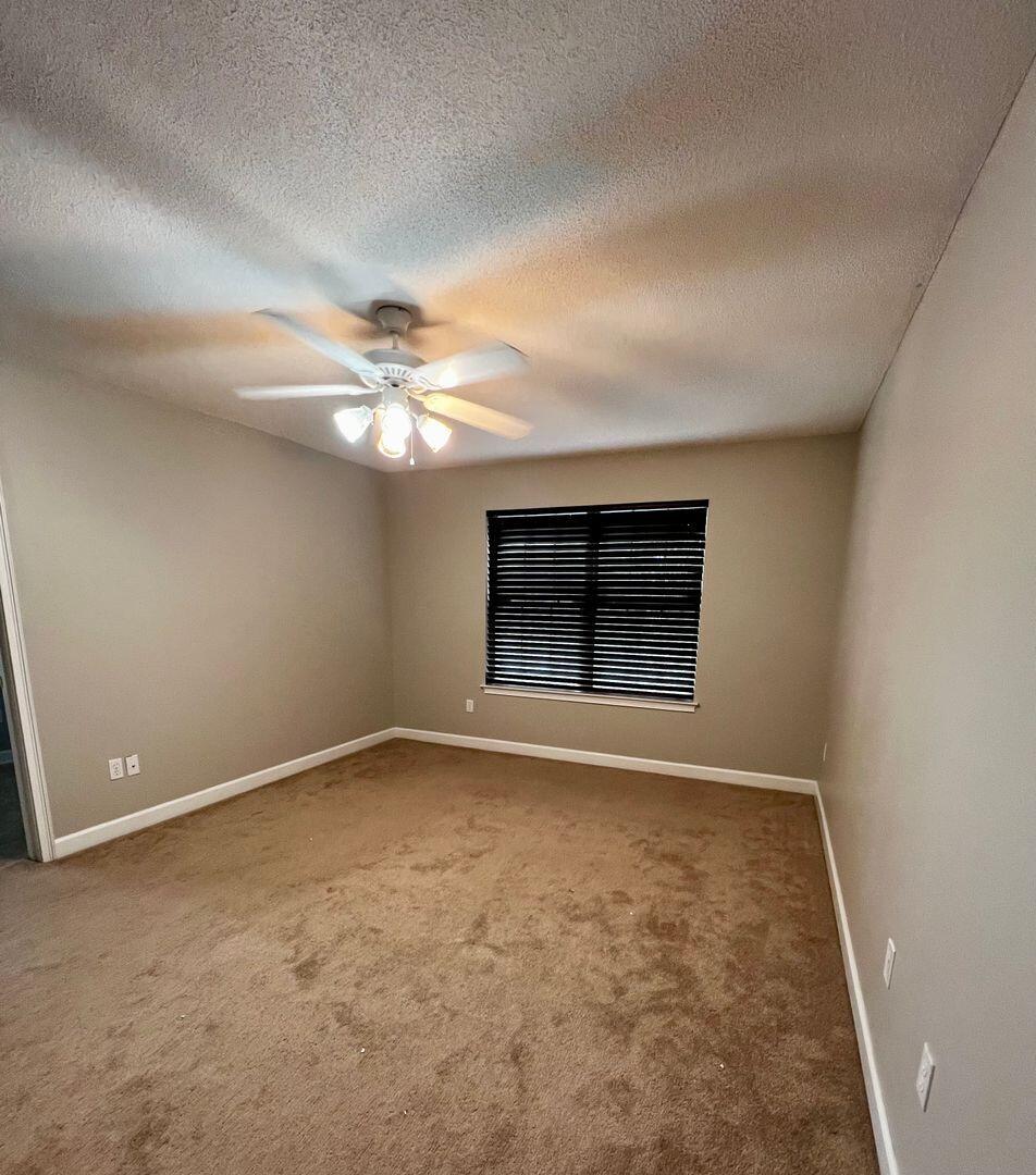 23 3rd Street Shalimar, FL 32579 - Photo 5 of 15 a view of an empty room with a window