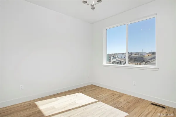 a bathroom with a sink a light fixture a vanity and a mirror