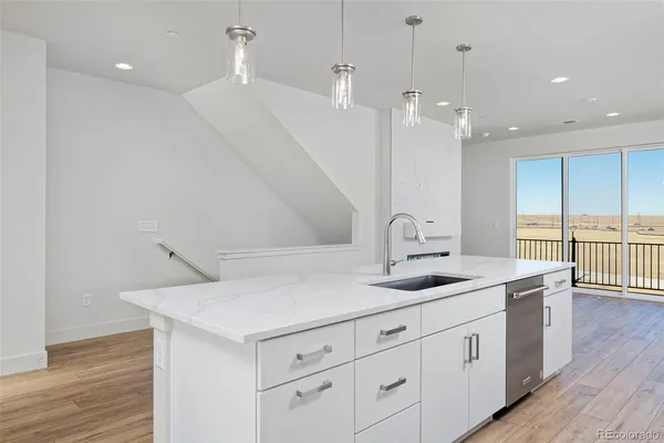 a kitchen with a sink and cabinets