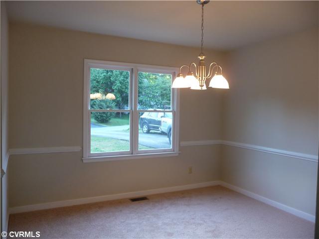 5001 Tulip Oak Road Chesterfield, VA 23832 - Photo 2 of 12 Dining Room - Enjoy entertaining with your stylish dining room, featuring chair ariling and new light fixture!