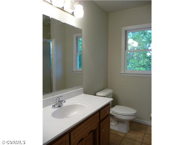 5001 Tulip Oak Road Chesterfield, VA 23832 - Photo 8 of 12 Master Bath - Master Bath with New Floor, new vanity top, light fixture, and tile shower. Linen closet.