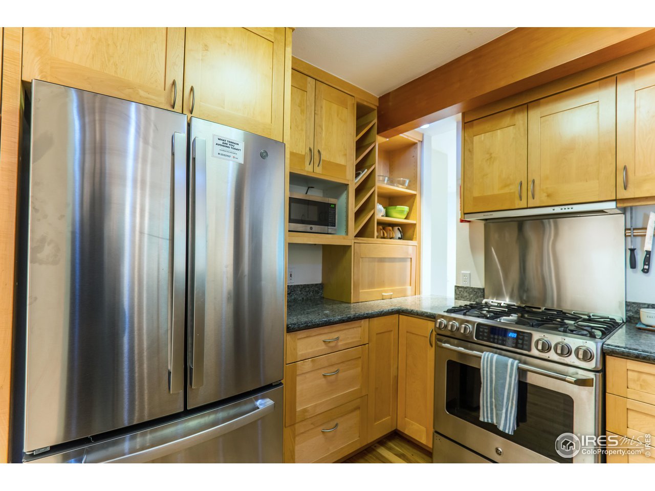 516 Valley View Drive Boulder, CO 80304 - Photo 13 of 35 Neatly Designed Kitchen with Peek-a-Boo Opening to Living Rm