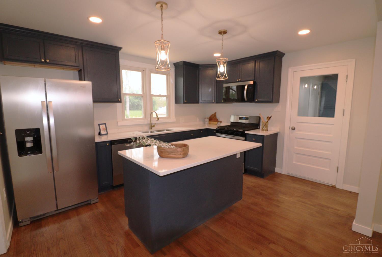 4731 Shephard Road Batavia, OH 45103 - Photo 9 of 25 Brand new kitchen, new cabinets, appliances, lighting and quartz countertops.