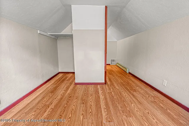 a view of small space with wooden floor