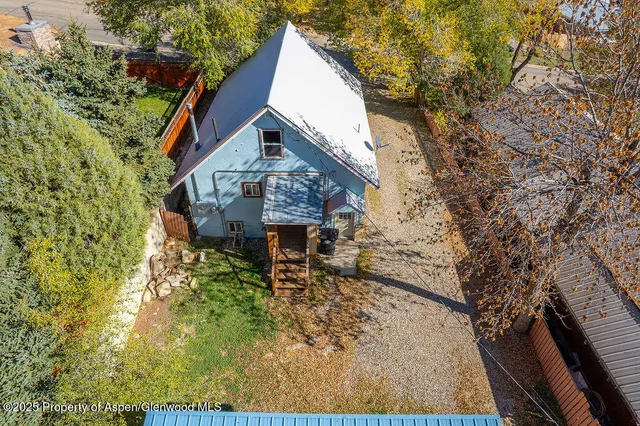 a view of a house with a tree