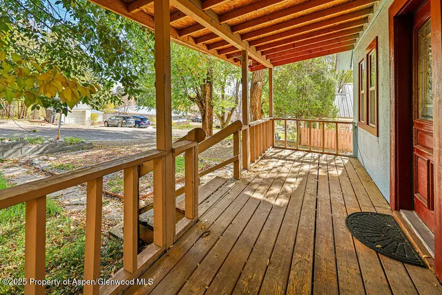 a view of balcony with wooden floor