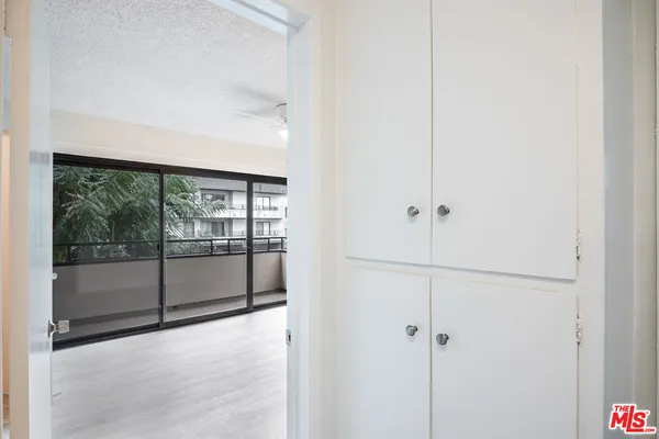 a view of an empty room with a balcony